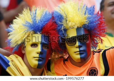 BRASILIA, BRAZIL - June 19, 2014: Soccer fans celebrating at the 2014 World Cup Group C game between Colombia and Ivory Coast at Estadio Nacional Mane Garrincha. NO USE IN BRAZIL.