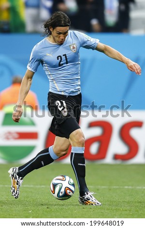 SAO PAULO, BRAZIL - June 19, 2014: Edison Cavani of Uruguay kicks the ball during the 2014 World Cup Group D game between Uruguay and England at Arena Corinthians. No Use in Brazil.