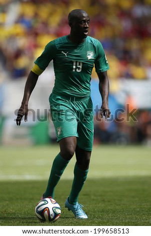 BRASILIA, BRAZIL - June 19, 2014: Yaya Toure of Ivory Coast kicks the ball during the 2014 World Cup Group C game between Colombia and Ivory Coast at Estadio Nacional. No Use in Brazil.