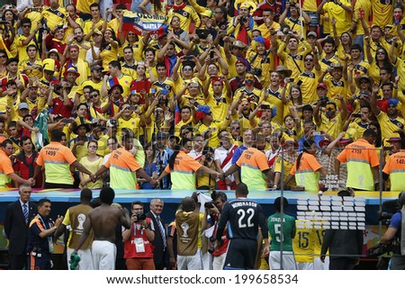 BRASILIA, BRAZIL - June 19, 2014: Soccer fans celebrating at the 2014 World Cup Group C game between Colombia and Ivory Coast at Estadio Nacional. No Use in Brazil.