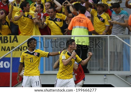 BRASILIA, BRAZIL - June 19, 2014: James Rodriguez of Colombia celebrates after scoring a goal during the 2014 World Cup game between Colombia and Ivory Coast at Estadio Nacional. No Use in Brazil.