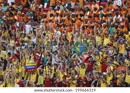 BRASILIA, BRAZIL - June 19, 2014: Soccer fans celebrating at the 2014 World Cup Group C game between Colombia and Ivory Coast at Estadio Nacional. No Use in Brazil.