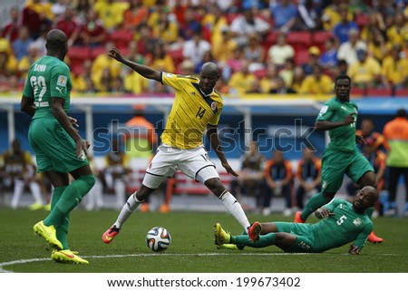 BRASILIA, BRAZIL - June 19, 2014: Ibarbo of Colombia and Zokora of Ivory Coast compete for the ball during the World Cup game between Colombia and Ivory Coast at Estadio Nacional. No Use in Brazil