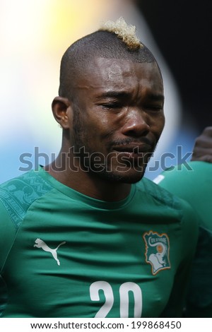 BRASILIA, BRAZIL - JUNE 19, 2014 : Serey Die during Ivory Coast National Anthem at the 2014 World Cup Group C game between Colombia and Ivory Coast at Estadio Nacional. NO USE IN BRAZIL.