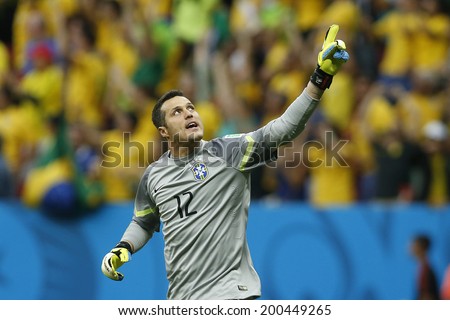 BRASILIA, BRAZIL - June 23, 2014: Julio Cesar of Brazil celebrates after Fred scores a goal during the game between Brazil and Cameroon at Estadio Nacional Mane Garrincha. No Use in Brazil.