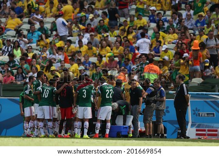 FORTALEZA, BRAZIL - JUNE 29, 2014: Team Mexico during technical break at the World Cup Round of 16 game between the Netherlands and Mexico in the Castelao stadium.  NO USE IN BRAZIL.