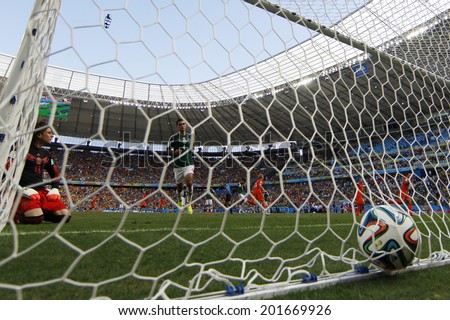 FORTALEZA, BRAZIL - JUNE 29, 2014: Huntelaar of Netherlands scores the winning goal during the World Cup Round of 16 game between the Netherlands and Mexico in the Castelao stadium.  NO USE IN BRAZIL.