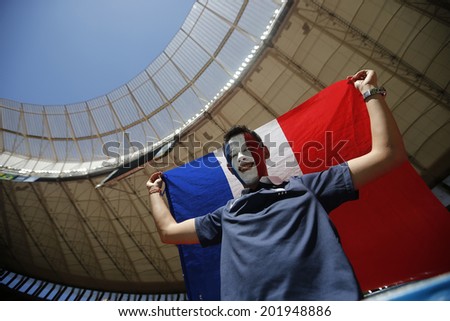 BRASILIA, BRAZIL - June 30, 2014: Soccer fan of France celebrating at the 2014 World Cup Round of 16 game between France and Nigeria at Estadio Nacional Mane Garrincha. NO USE IN BRAZIL.
