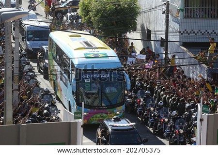 FORTALEZA, BRAZIL - JULY 03, 2014 - The bus carrying the national team of Brazil is welcomed by fans as it arrives to the Presidente Vargas stadium for a training session. NO USE IN BRAZIL.