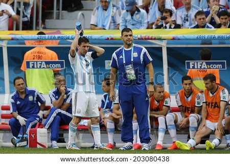 BRASILIA, BRAZIL - JULY 05, 2014: Messi of Argentina refreshing during the World Cup Quarter-finals game between Argentina and Belgium in the Estadio Nacional. NO USE IN BRAZIL.