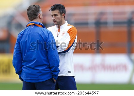 SAO PAULO, BRAZIL - July 8, 2014: Coach Louis Van Gaal (L) and Van Persie during Netherlands training session at Arena Corinthians in preparation for the game against Argentina. NO USE IN BRAZIL.