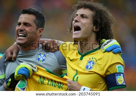 BELO HORIZONTE, BRAZIL - July 8, 2014: Julio Cesar and David Luiz during Brazil National Anthem at the 2014 World Cup Semi-finals game between Brazil and Germany at Mineirao Stadium. NO USE IN BRAZIL.