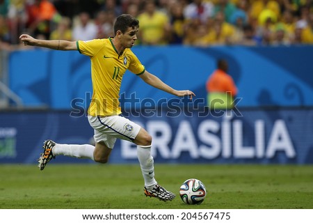 BRASILIA, BRAZIL - JULY 12, 2014: Oscar kicks the ball of Brazil during the World Cup Third place game between Brazil and the Netherlands in the Estadio Nacional. NO USE IN BRAZIL.