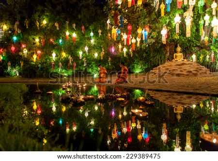 CHIANG MAI, THAILAND - NOVEMBER 04, 2014: Loy Krathong ceremony: Buddhist monks release krathongs to water in Phan Tao Temple.