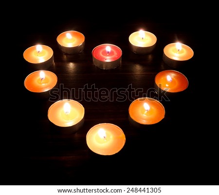 Heart candles on a dark background