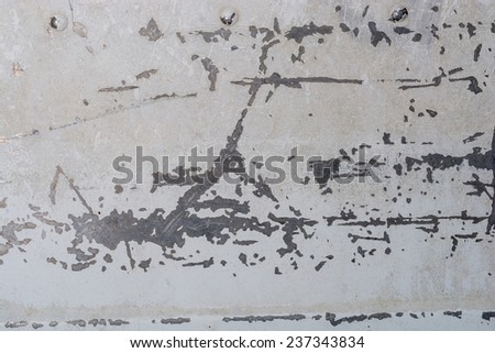 Detail of an old white metal boat with chipped paint, scratches and sign of wear