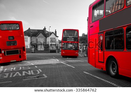 Red London Bus in the city on a black and white photography.