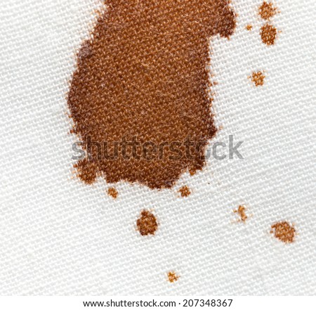 drops of coffee on a white cloth