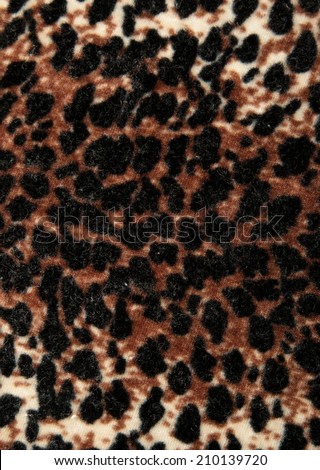 material as a background with black and brown spots