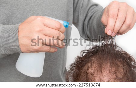 spray bottle in hand barber