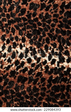 material as a background with black and brown spots