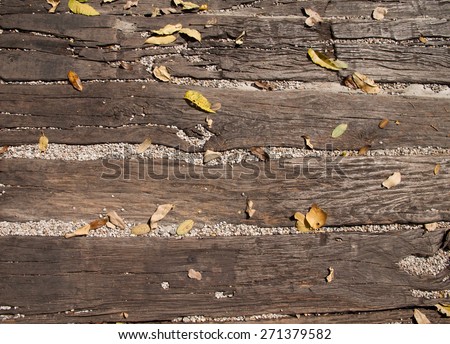 Leaves fallen on wooden ground ground