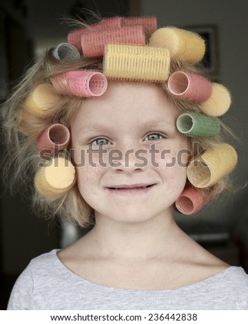 Little girl with hair rollers