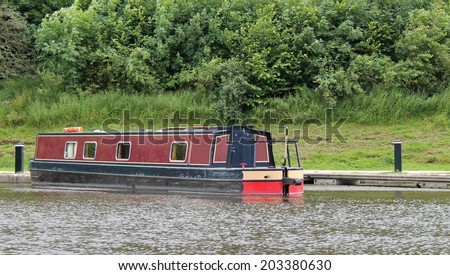 A Traditional Narrow Boat Moored in a Canal Basin.