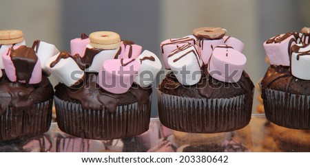 A Row of Sweet Confectionery Dessert Cakes.