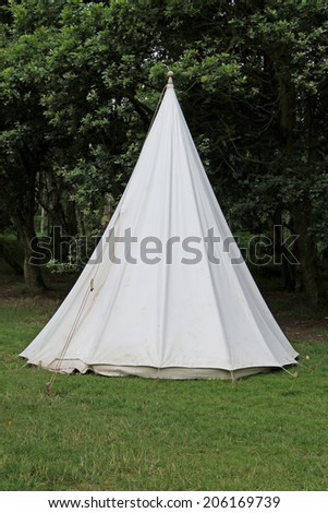 A Traditional White Canvas Bell Shaped Camping Tent.