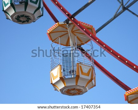 A Carriage on a Big Wheel at a Fun Fair.