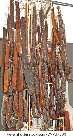 A Hanging Display of Various Smoked Meats.