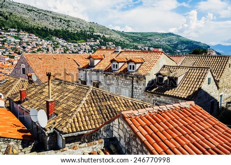 Red roofs in Dubrovnik background