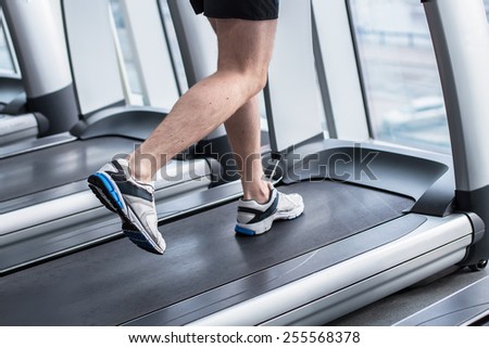 Legs running  on the treadmill close up