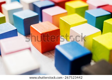 Colored wooden blocks looking like pixels