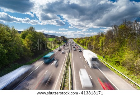 Vehicles in Motion on Busy Rural Motorway