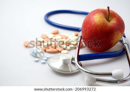 Medicine and apple, health vs sickness