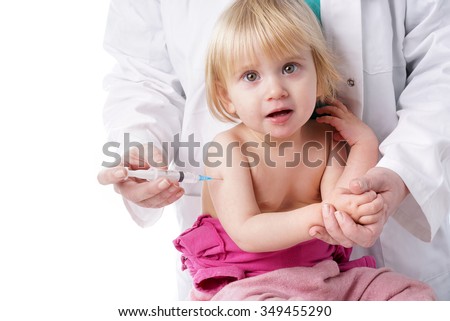 Doctor gives baby girl an injection.  The doctor gives the child an injection in the upper arm . It can be both a vaccination or as part of the girl\'s medical treatment