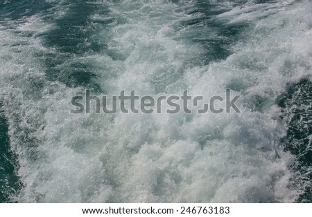 Surface of the water or the pressure of the air bubbles in the water