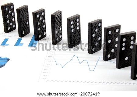 some domino stones on a blue  business chart