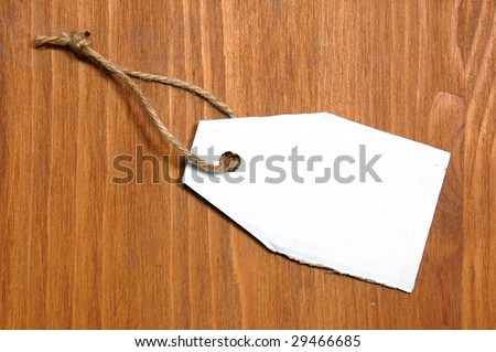 blank price tag with copyspace on a wood texture