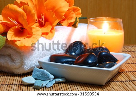 spa and wellness concept with flowers zen stones and towel