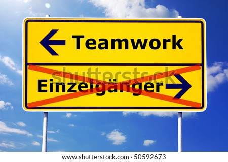 team or teamwork concept with a german sign