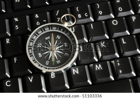 computer keyboard and compass showing internet navigation concept