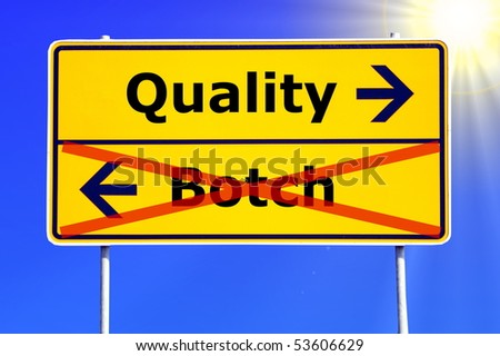 quality or botch business concept with yellow road sign
