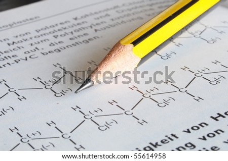 chemical or chemistry education with pen formula book and paper