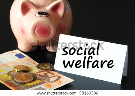 social welfare concept with money and piggy bank on black background