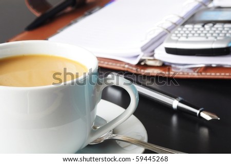 cup of coffee in the business office showing success