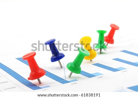 business growth chart with colorful pins on white background