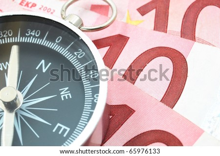 euro money and compass showing financial success